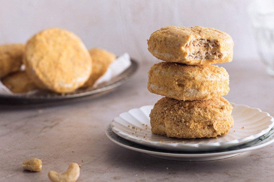 A stack of Filipino cookies, made with buttercream sandwiched between two cashew-meringue wafers coated with cookie crumbs - select to zoom